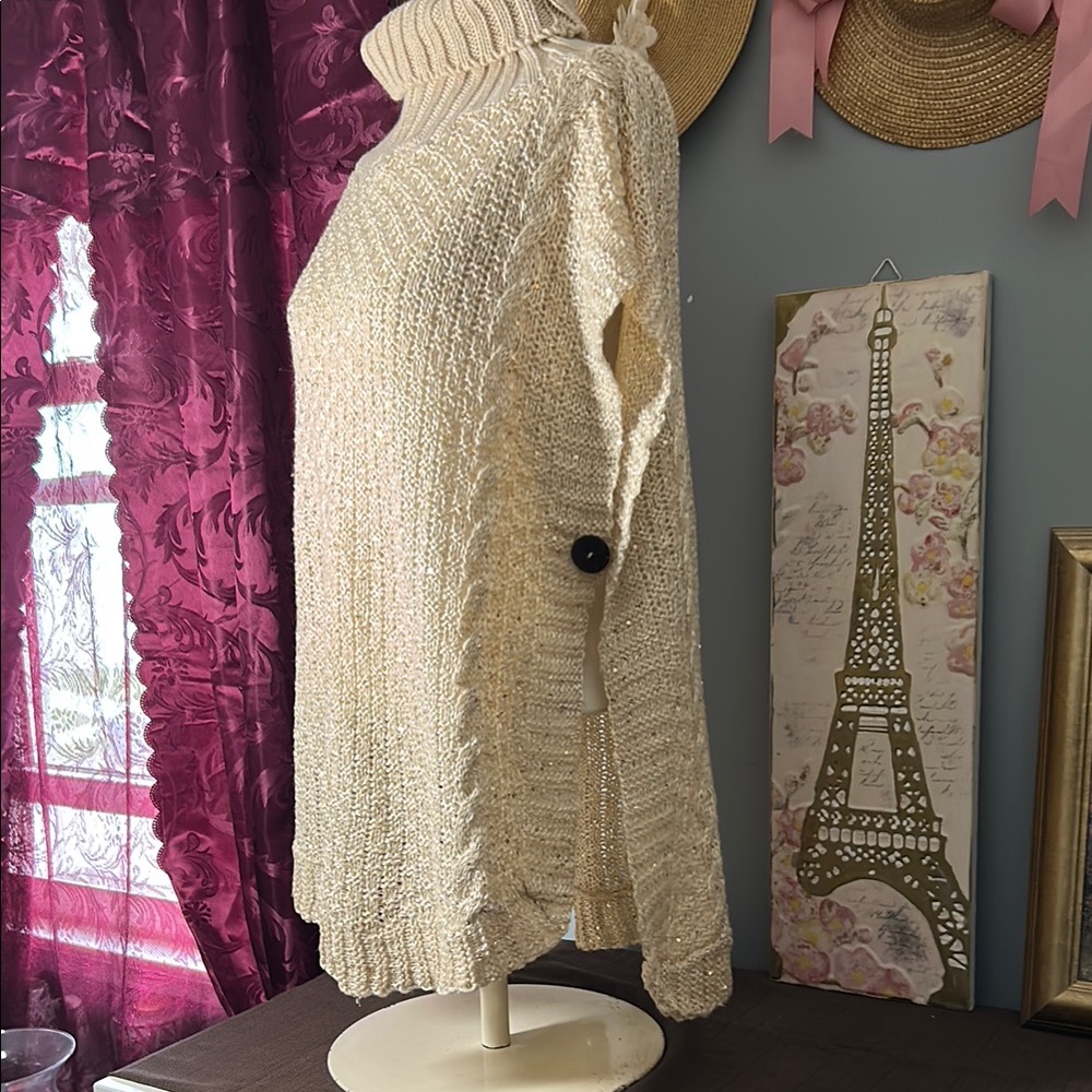 Cozy Cream & gold sleeveless Turtleneck Sweater with wooden button side closure